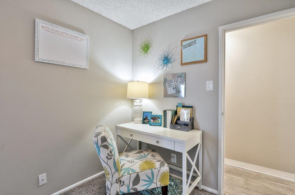 Park at Idlewild Apartments  desk with a lamp and a chair in a room