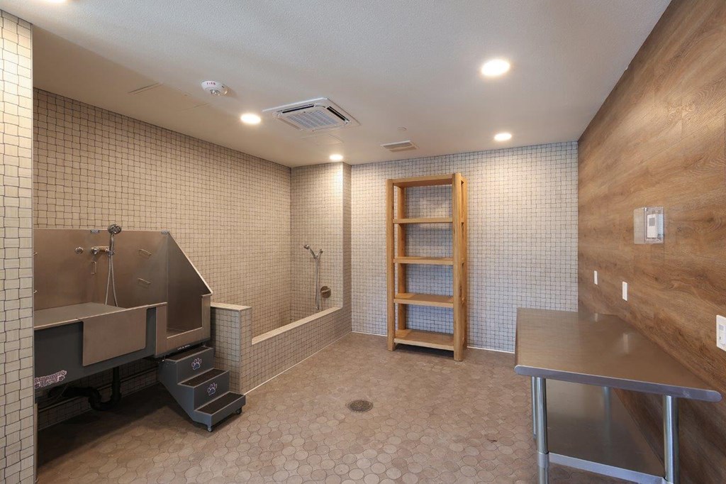 a large bathroom with a sink and a bath tub
