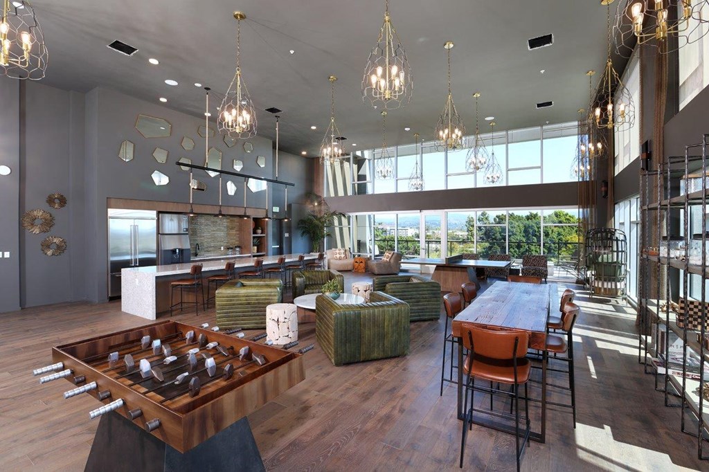 a large room with a table and chairs and a large window