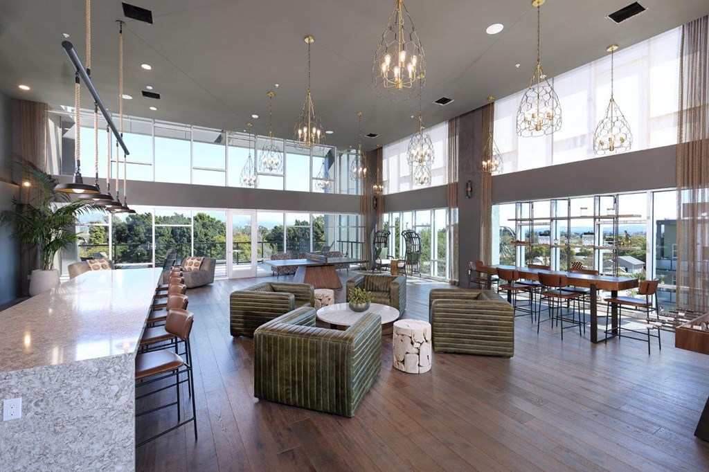 a large lobby with couches and chairs and a bar