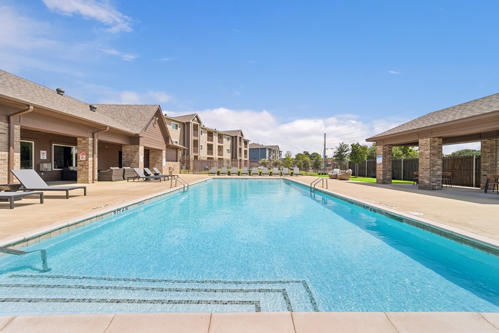 A large swimming pool in a residential area.