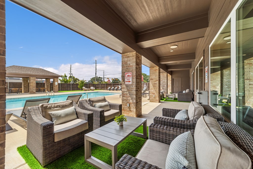 A patio with a table and chairs is shown.