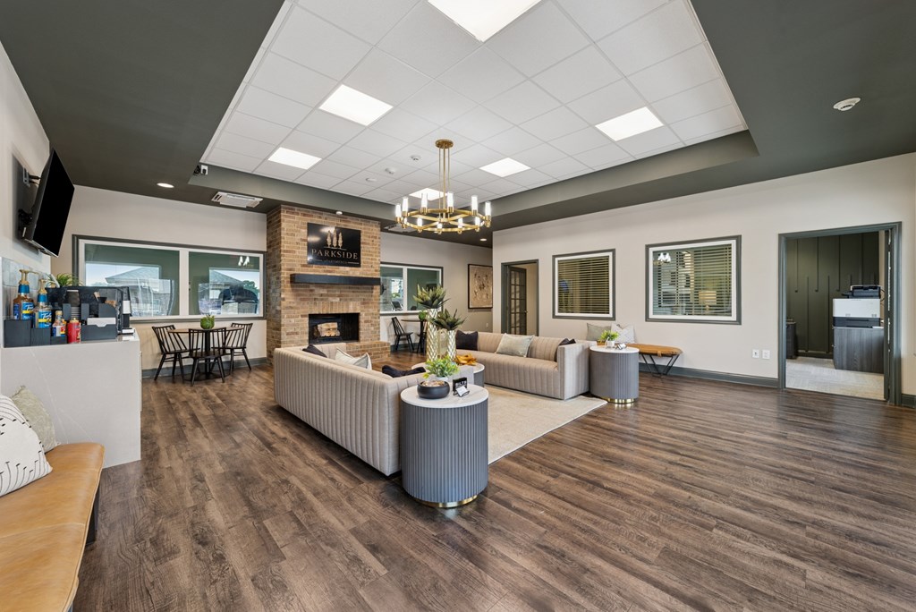 A modern living room with a fireplace and a flat screen TV.