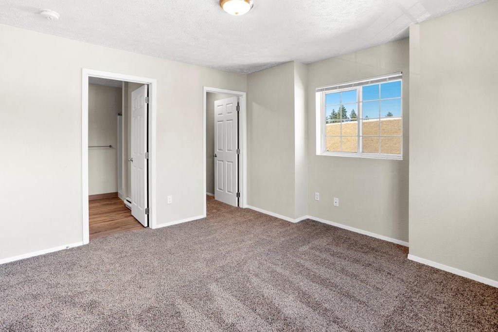 Peaks at Falls Park Bedroom with Attached Bathroom and Walk-In Closet