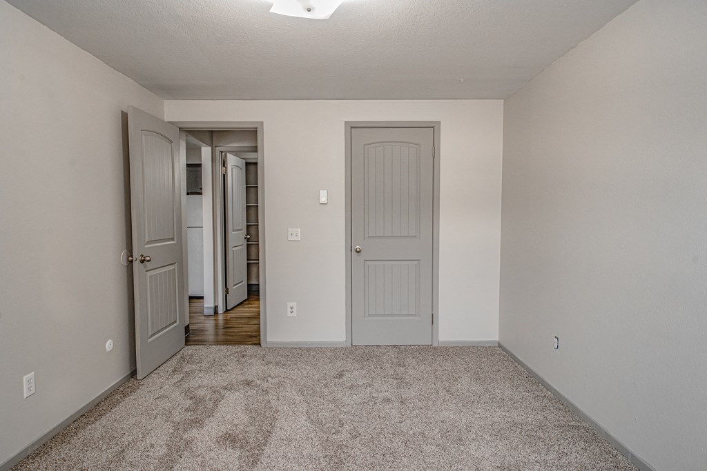 Philippi Plaza Apartments bedroom with carpet