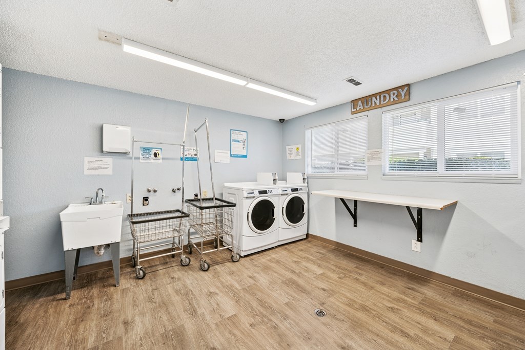 A laundry room with a washer and dryer.