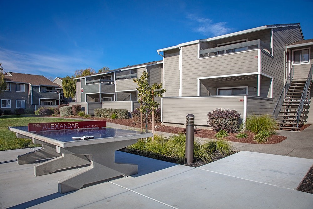 The Alexandar Outdoor Ping Pong Table and Apartment Homes Exterior