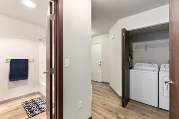 Pioneer Meadows Washer and Dryer Closet and View into Bathroom - Photo Gallery 17