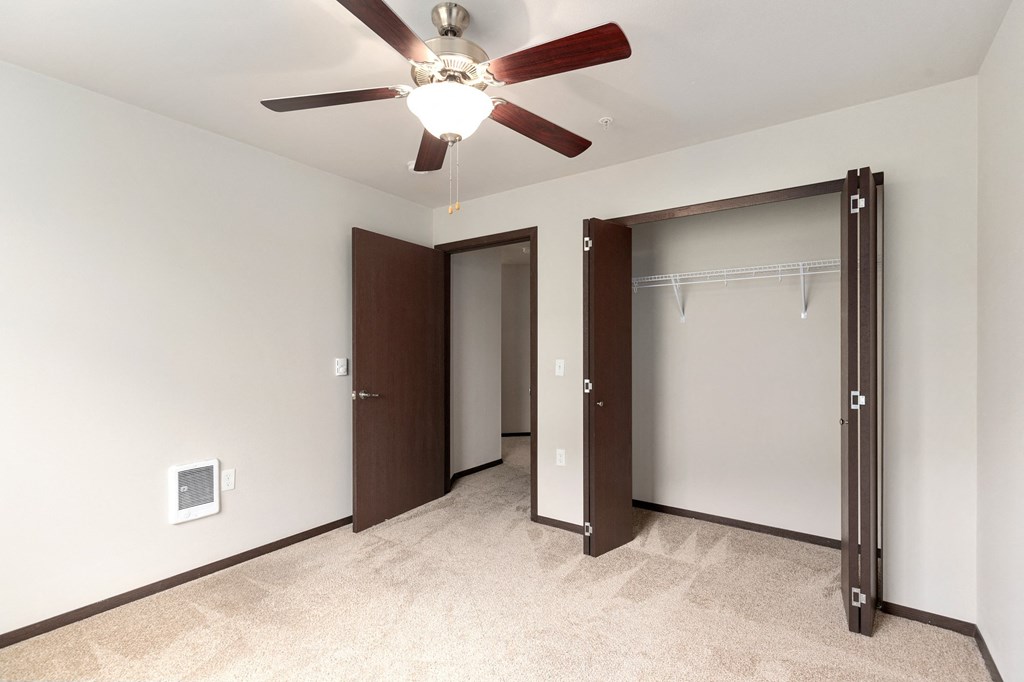 Pioneer Meadows Bedroom with Closet and Carpet