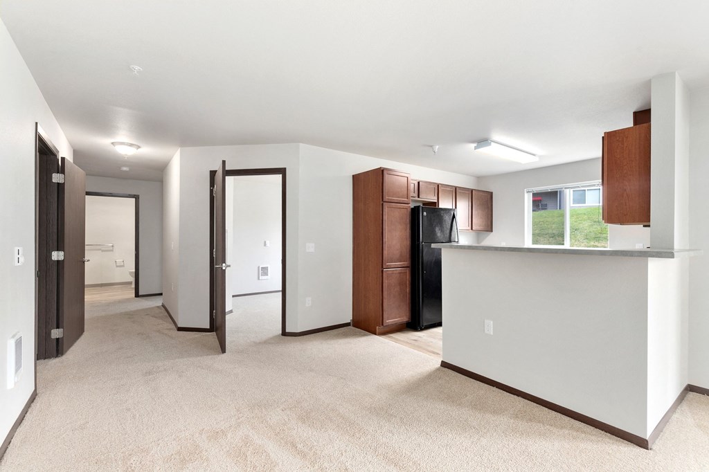Pioneer Meadows Kitchen and View into Bedroom