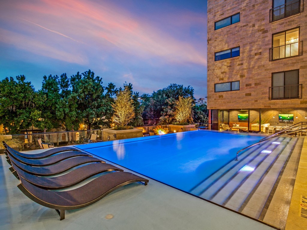 a swimming pool in front of a building