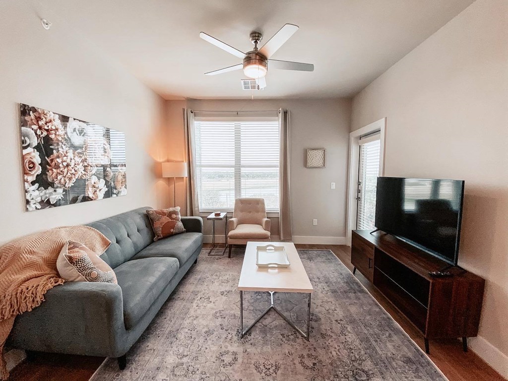 Presidio at River East Living Room with Private Patio