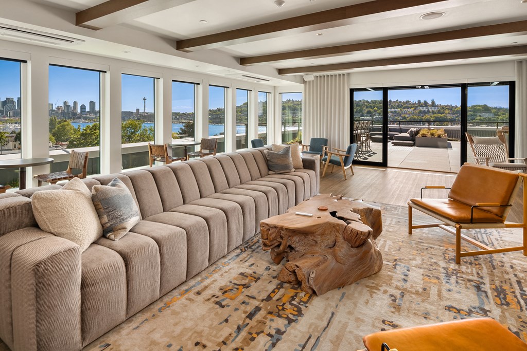 a large living room with a large couch and a table