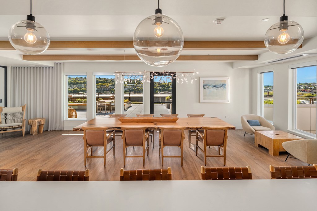 a large dining room with a large table and chairs