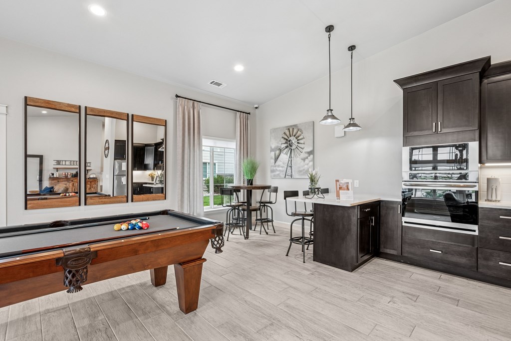 Remington Village Apartments in Gillette, Wyoming Clubhouse Lounge with Kitchen and Pool Table