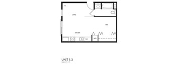 A floor plan of a small apartment with a bed, a kitchen, and a living room.
