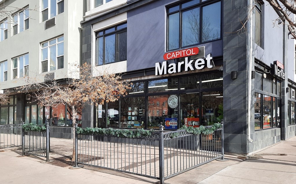 the exterior of a store with a gate in front of it