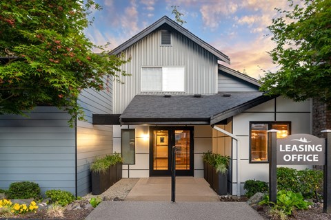 A building with a sign that says Leasing Office.