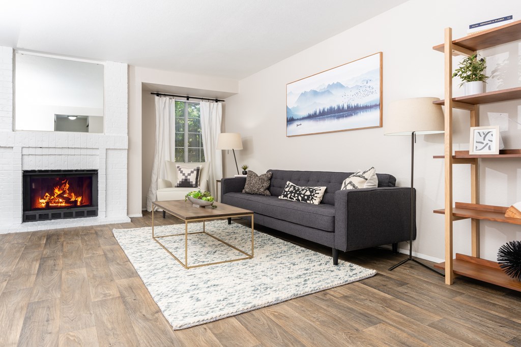 a living room with a fireplace and a couch