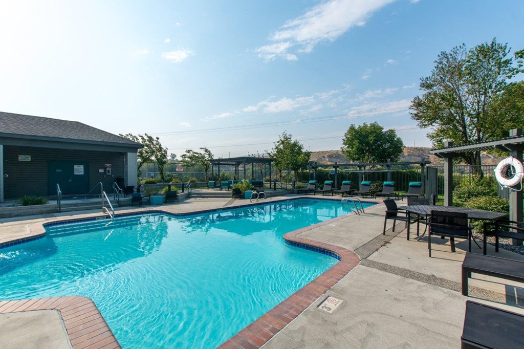 Riverpointe Apartments Pool with Lounge Chairs