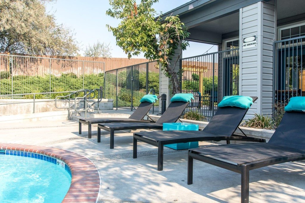 Riverpointe Apartments Pool with Lounge Chairs