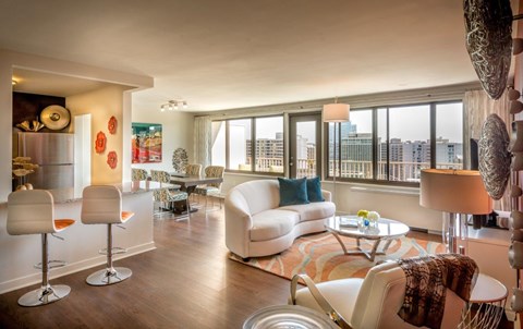 A living room with a white couch and a coffee table.