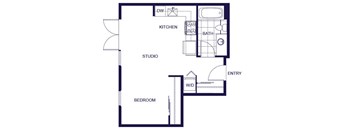 A floor plan of a house with a kitchen, bathroom, studio, and bedroom.