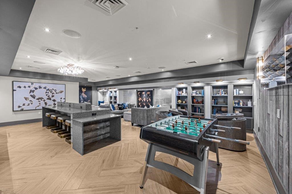 a game room with a chess board and tables