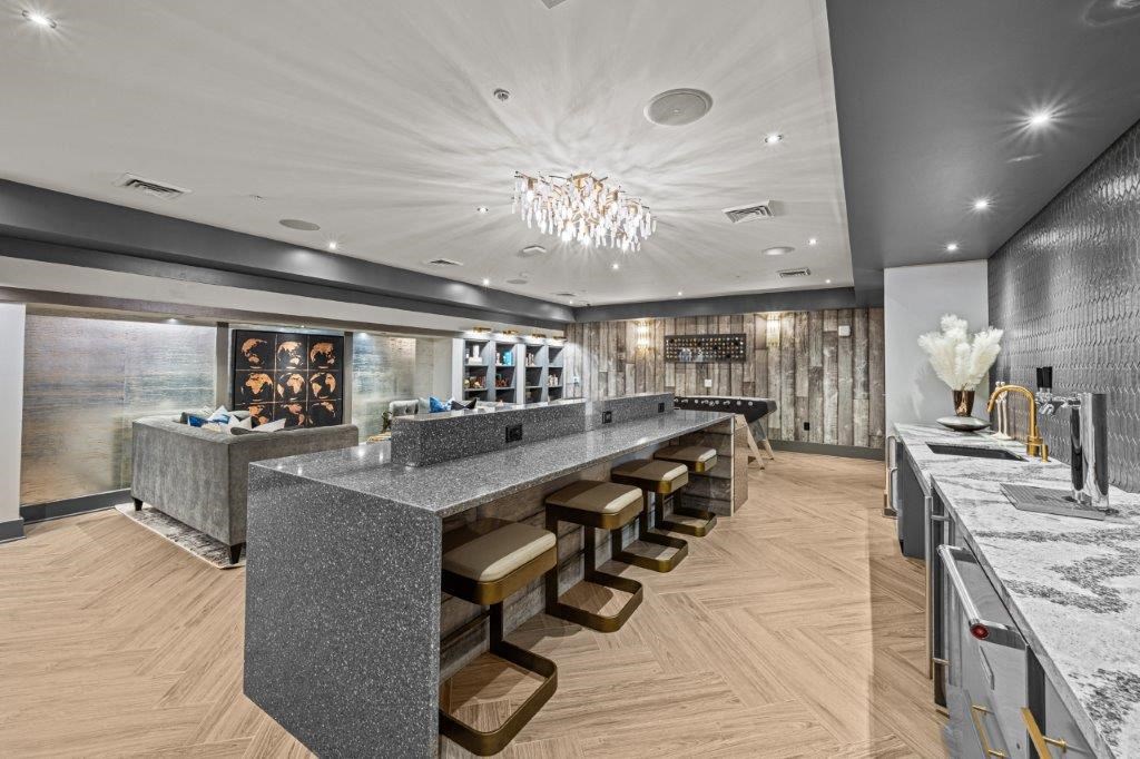 a large granite counter top in a restaurant with a long bar