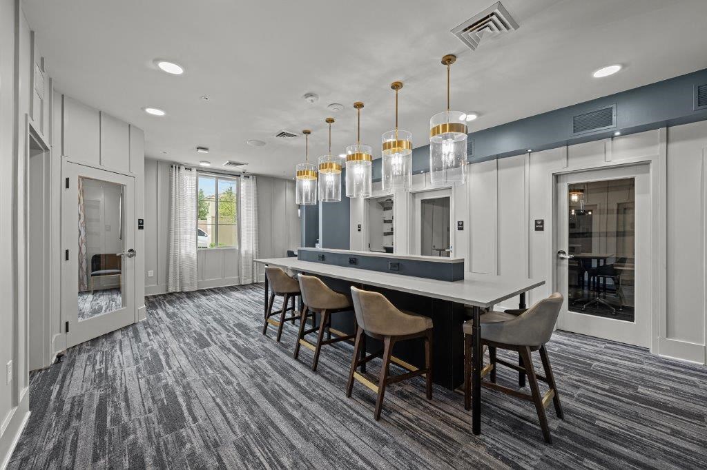 a large dining room with a long table and chairs