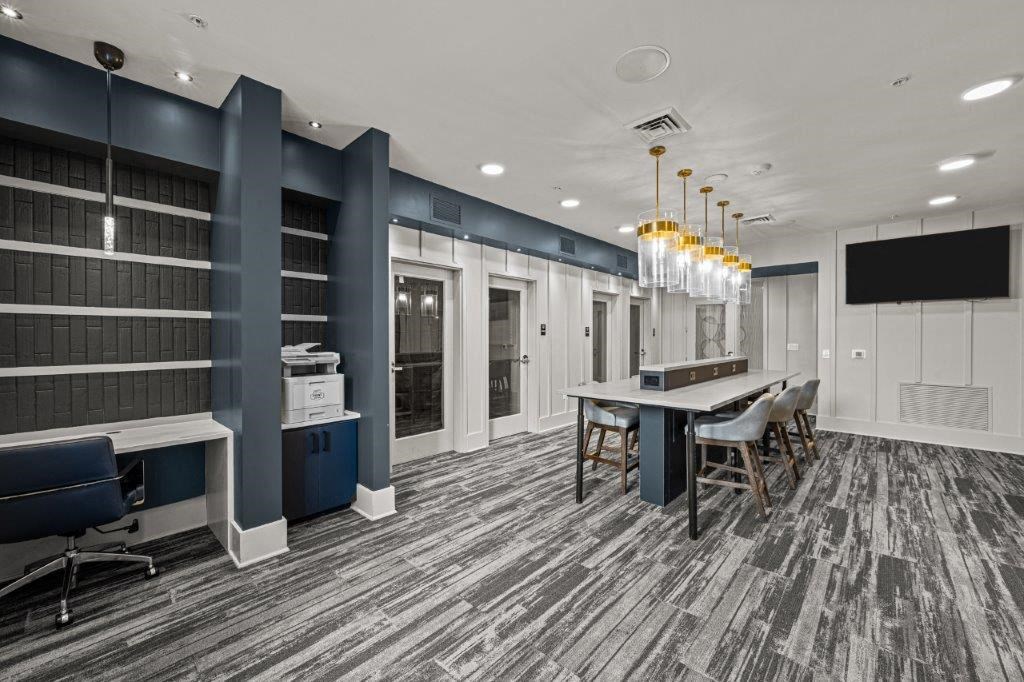 a conference room with a long table and chairs