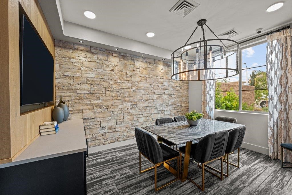a dining room with a table and chairs