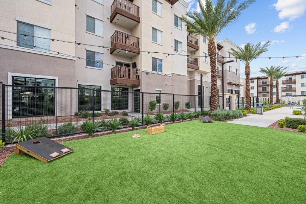 our apartments have a spacious yard with grass and a bocce court