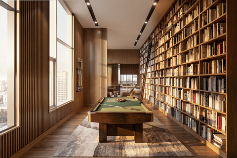 A room with a pool table and bookshelves.