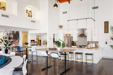 a kitchen and dining room with a table and chairs