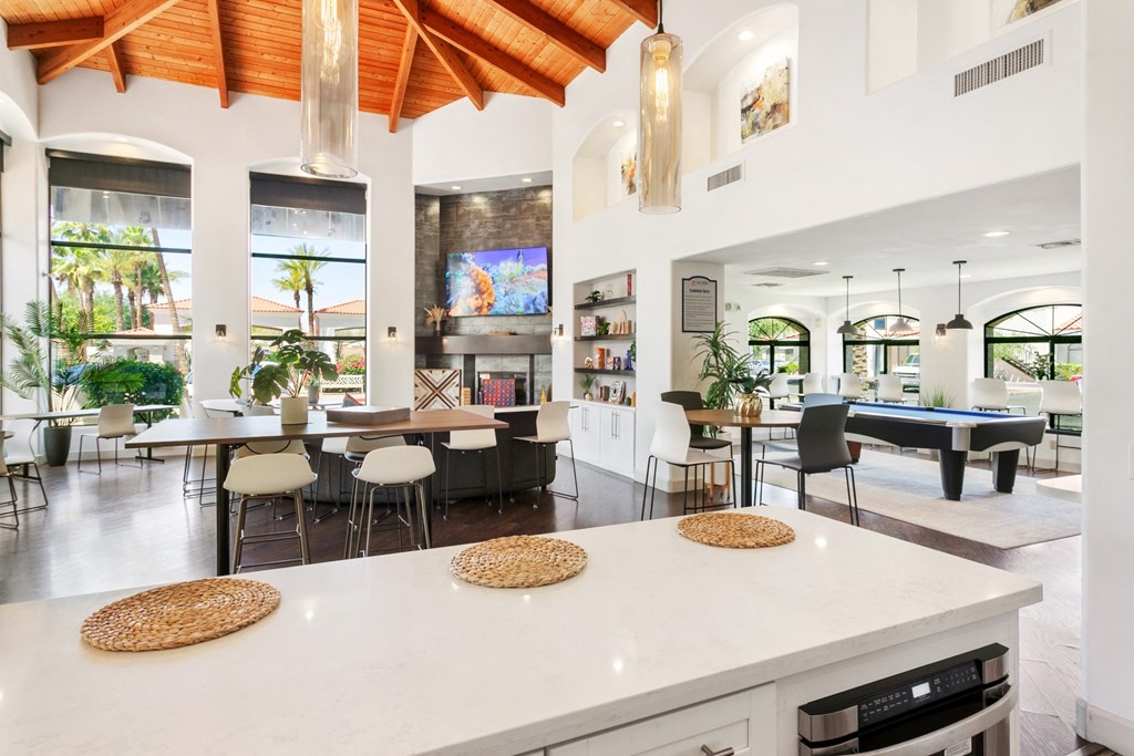 San Melia Apartments clubhouse kitchen with view of living room area