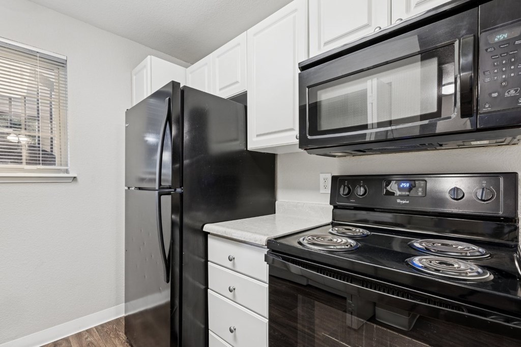 Kitchen With Black Appliances at Saratoga, Washington