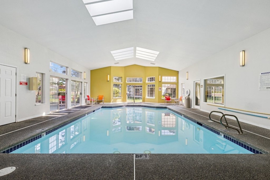A large indoor swimming pool with a tiled floor. at Saratoga, Everett, WA, 98204