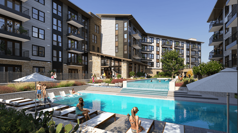 a pool in front of Jovie Lakeway apartment.