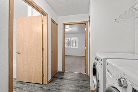 A laundry room with a washer and dryer.