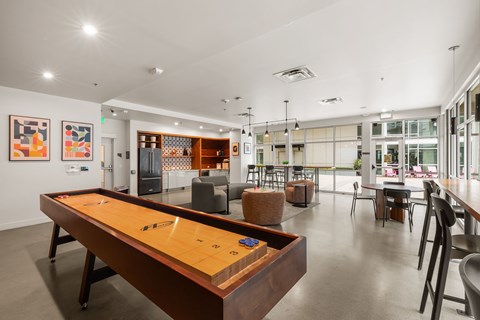 A pool table is in the middle of the room.