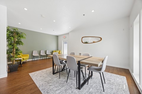 Community clubhouse long dining table with seating at Springwater Crossing apartments in Gresham, Oregon 97030