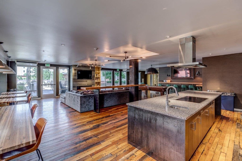 a large kitchen with a sink and a counter top