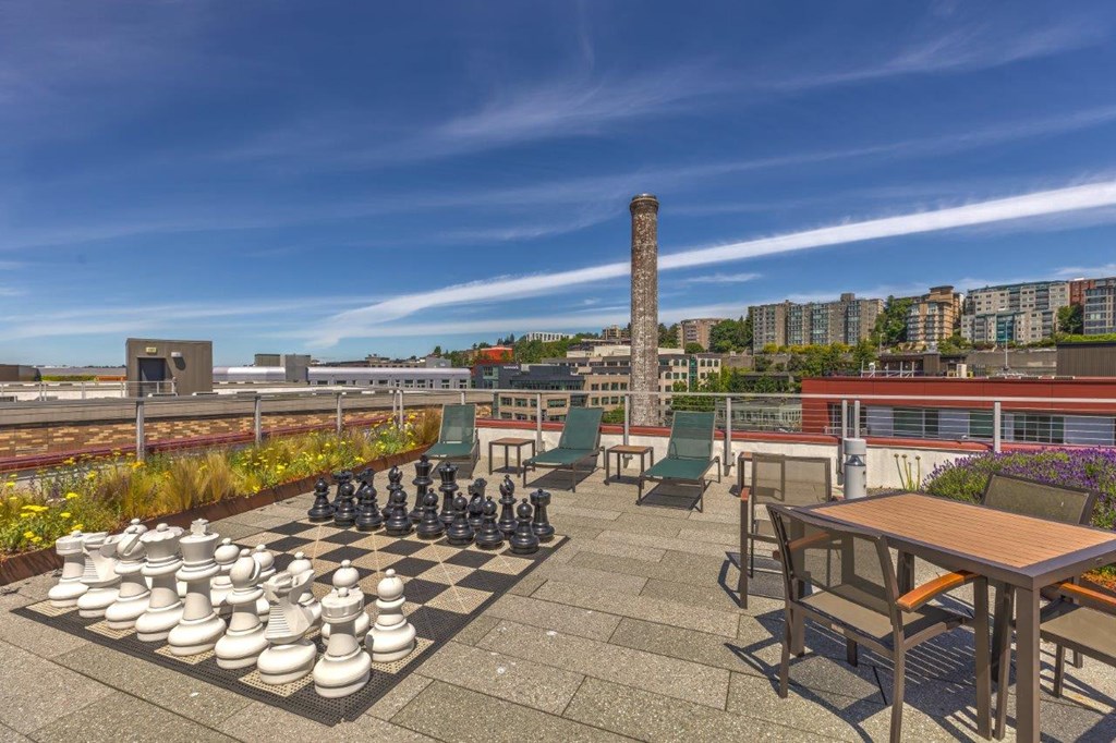 a chess board on a patio on top of a roof