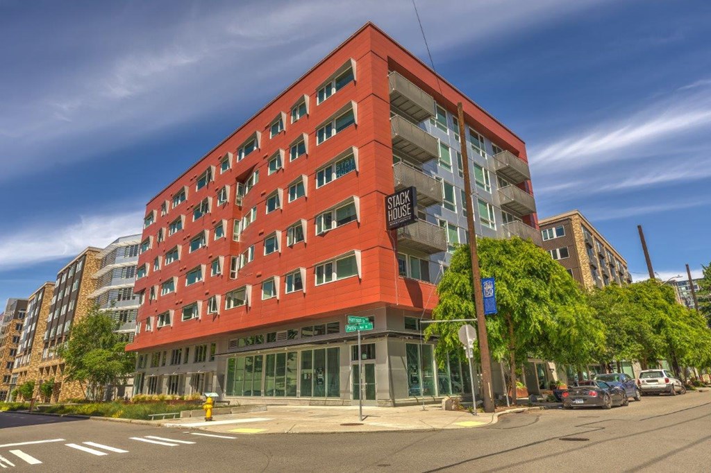 a building with an orange facade on a city street