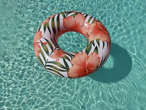 A floral patterned ring float in a pool.