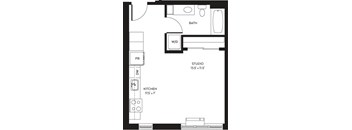 A floor plan of a studio apartment with a kitchen, bathroom, and workspace.