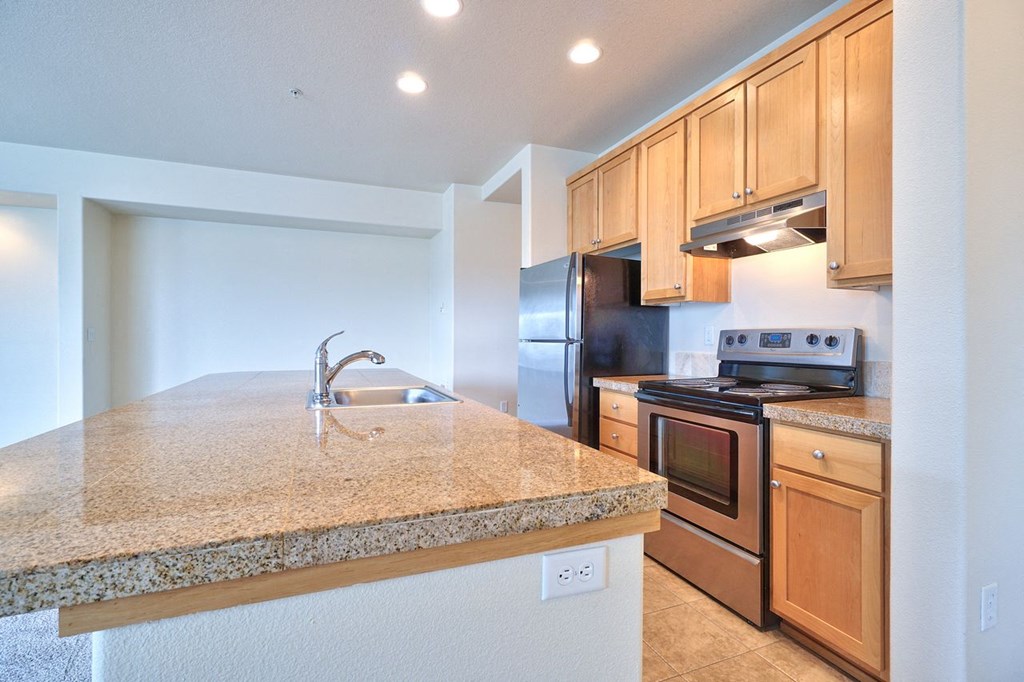 a kitchen with a granite counter top and a sink