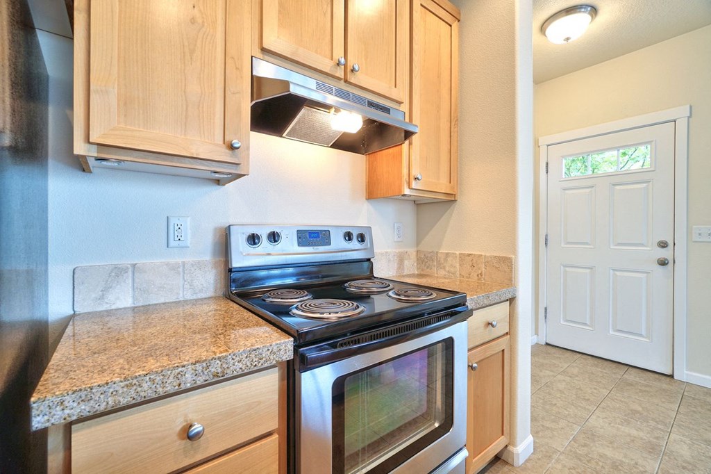 a kitchen with a stove and a microwave