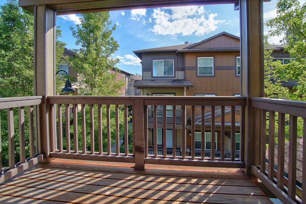 a view of a house from the deck of a porch